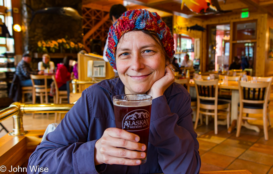 Caroline Wise enjoying her first beer in Alaska, which was better than the first bear we saw enjoying her!