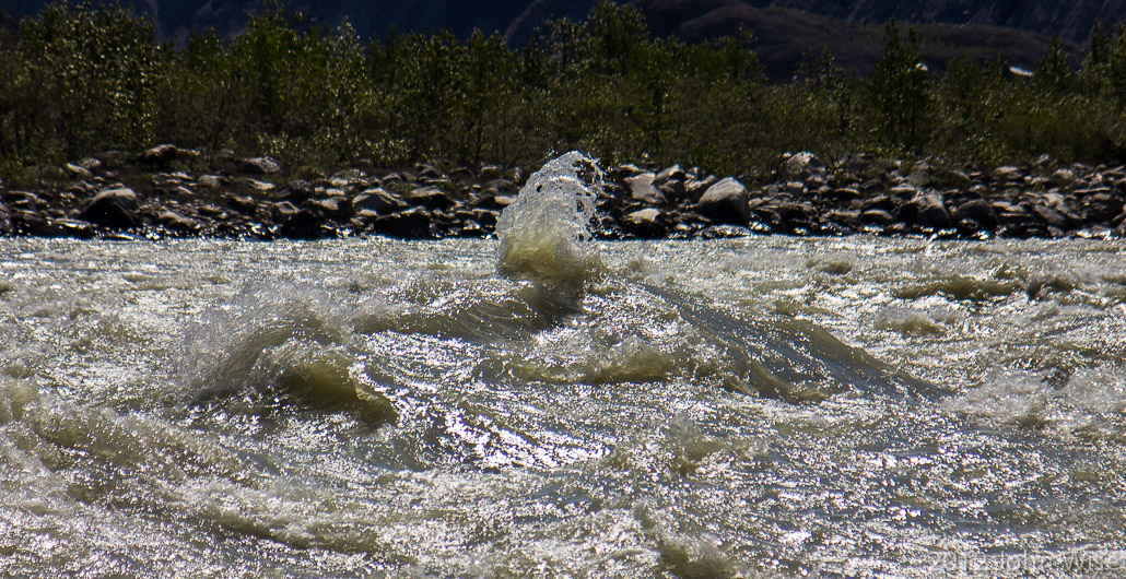 A wave kicking up in the rapid known as Lava North in Kluane National Park Yukon, Canada