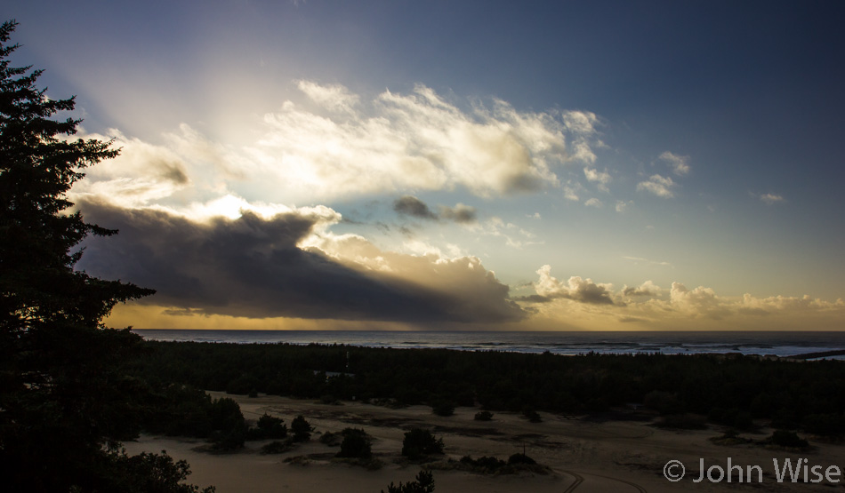 Sand dunes and ocean at sunset in Oregon