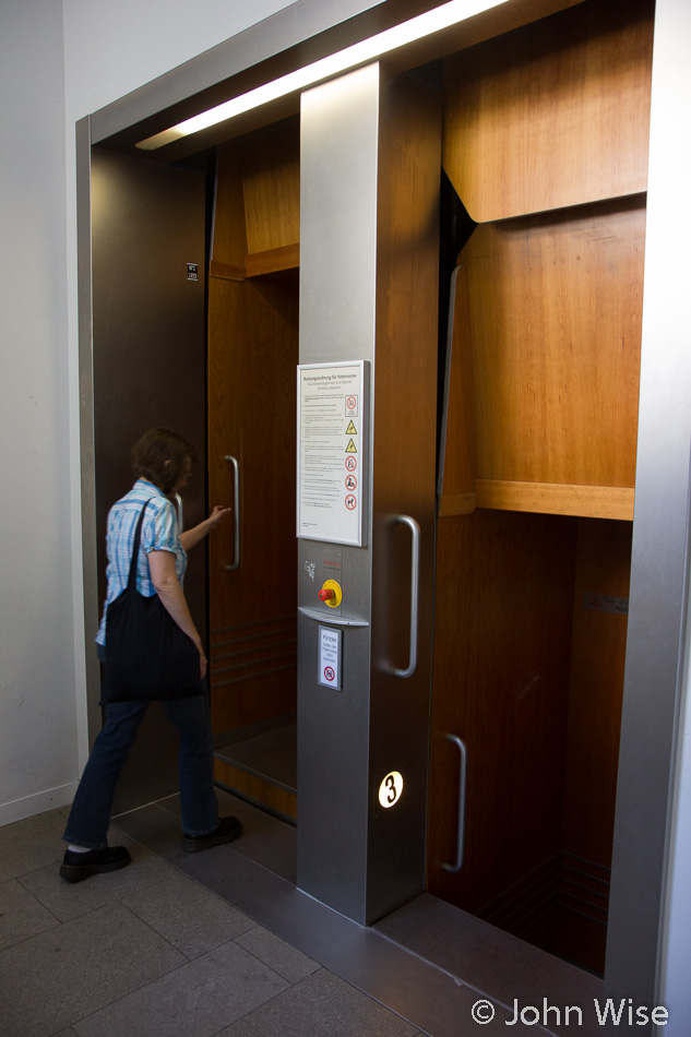 Caroline Wise entering a "paternoster" style elevator at Goethe University in Frankfurt, Germany. Formerly the IG Farben / Abrams Complex