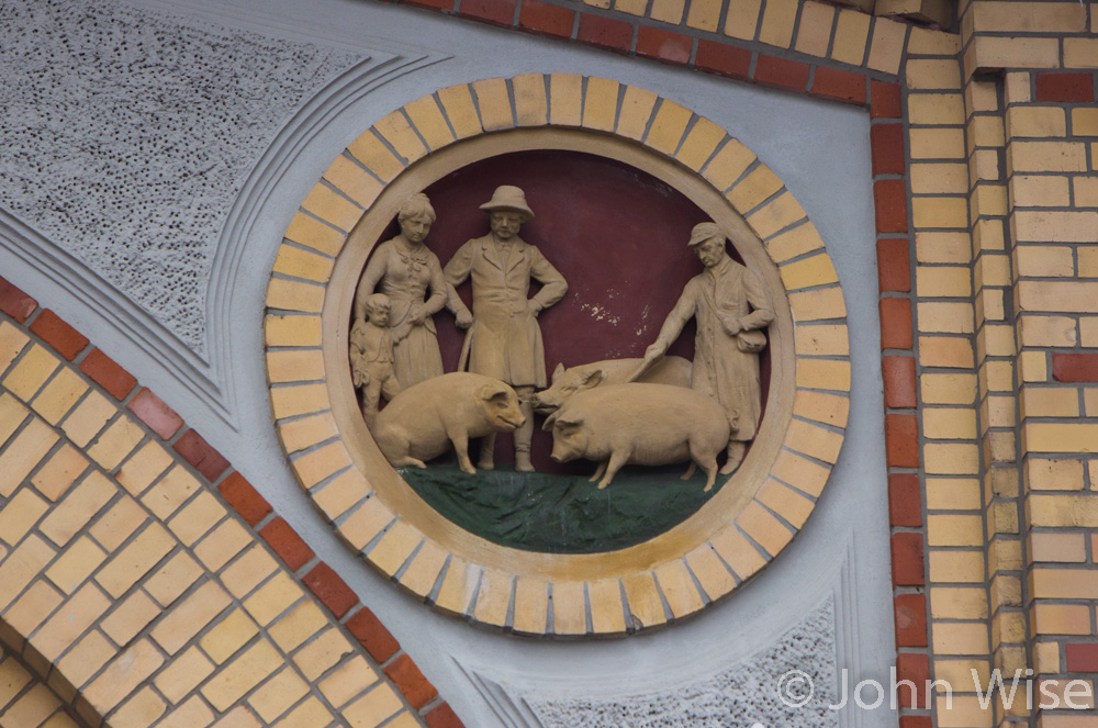 A building ornament depicting pigs going to market in the schlacthof area of Magdeburg, Germany