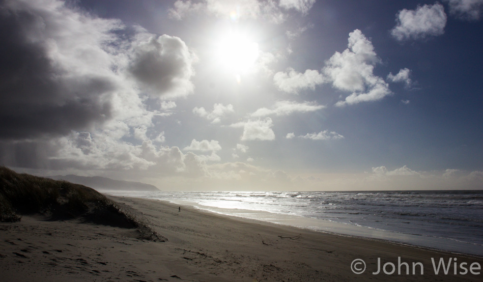 The mid-afternoon sun pushing storm clouds to the east on the Oregon coast