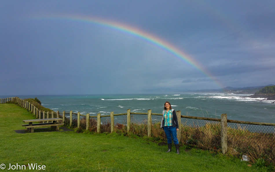 Caroline Wise under the rainbow on the Oregon coast