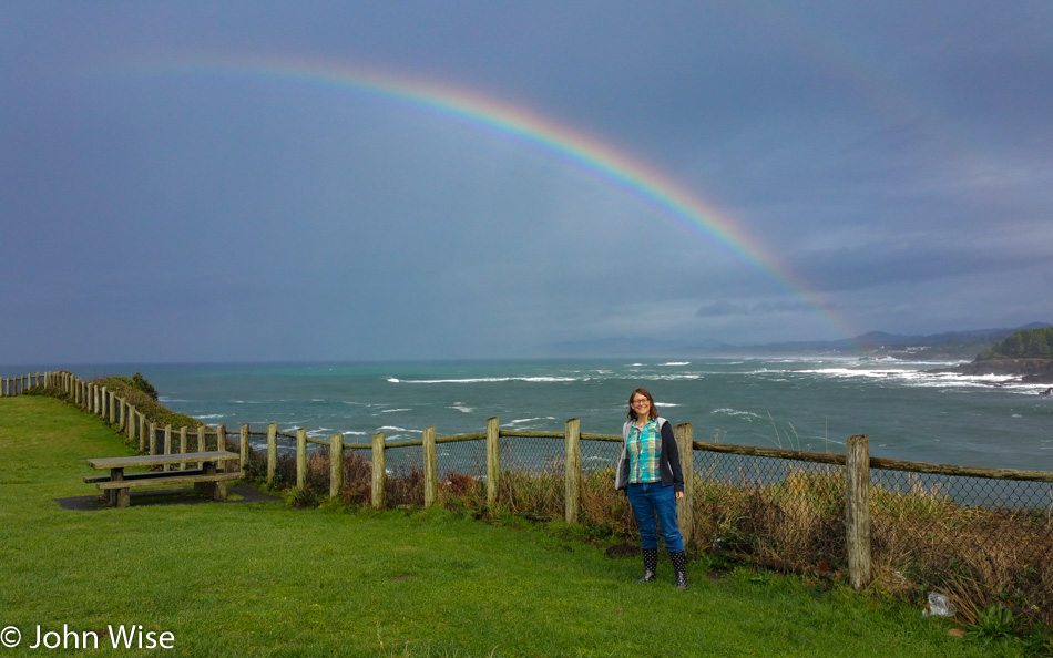 Caroline Wise under the rainbow on the Oregon coast