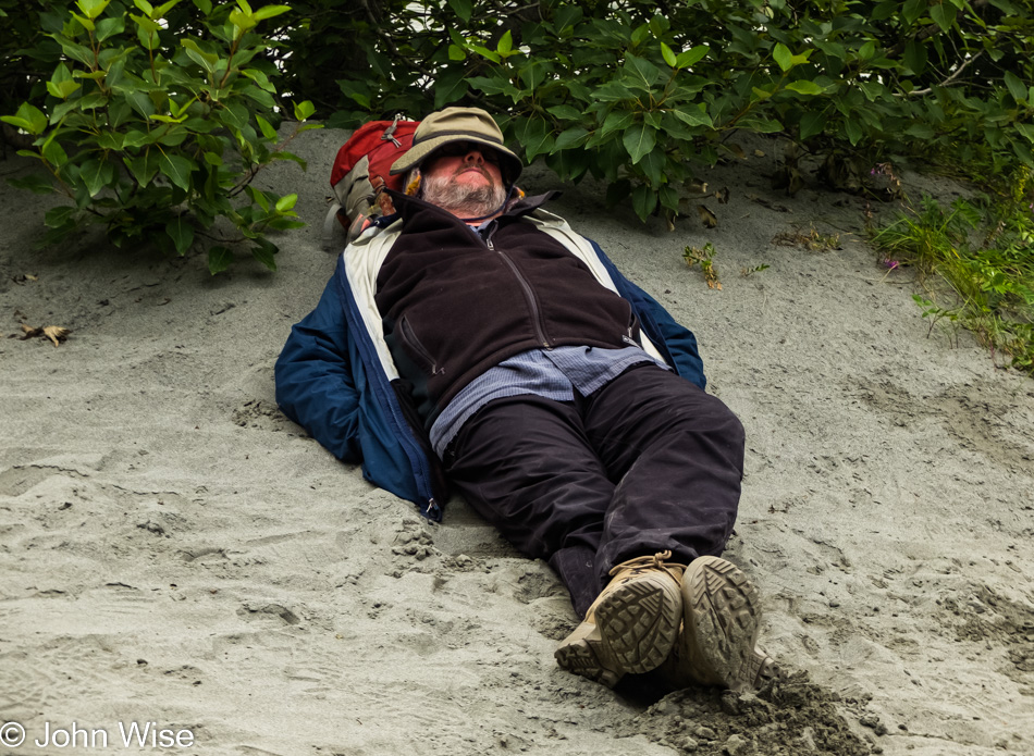 John Wise napping next to the Alsek River in the United States