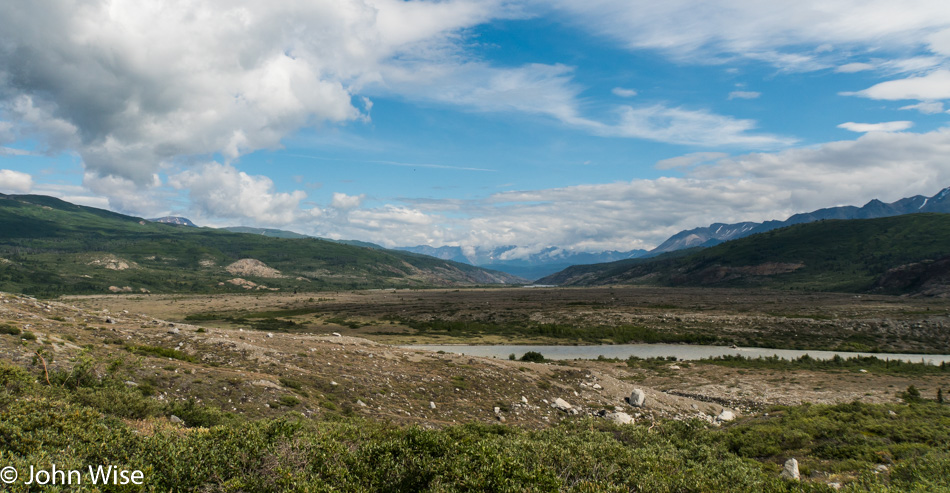 Standing on the end of the terminal moraine of Lowell Glacier in Yukon, Canada