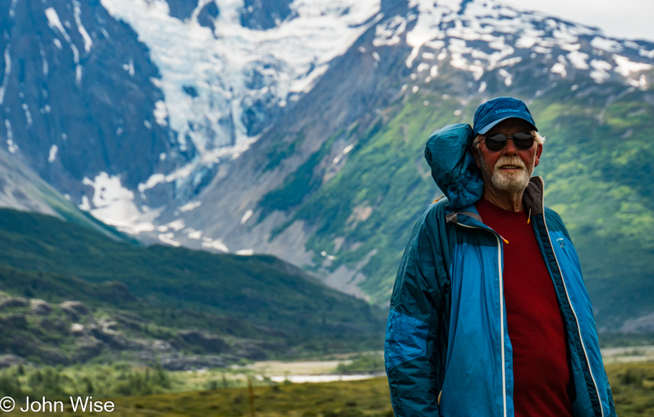 Frank "First Light" Kozyn in front of Mt. Blackadar on the Alsek River in Canada