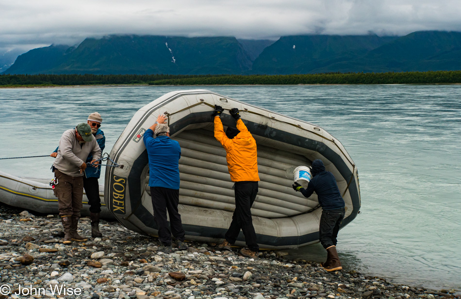 Breaking down rafts on the Alsek River in Dry Bay, Alaska