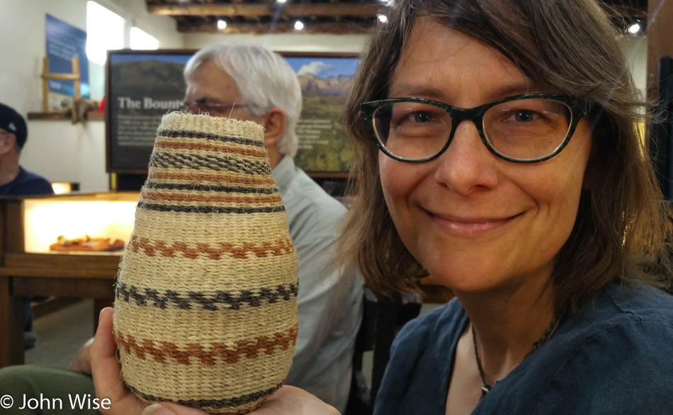 Caroline Wise holding a basket made of Yucca fiber at Tuzigoot National Monument in Arizona