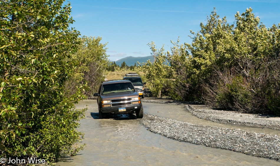 Mountain Travel Sobek vehicles delivering a bunch of adventurers to the put in of the Alsek River in Yukon, Canada