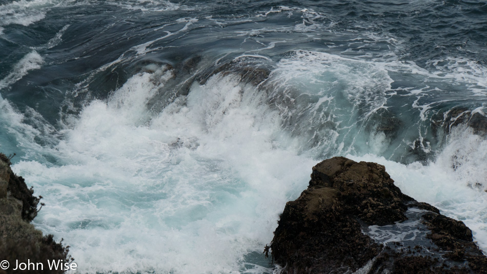 Surf spilling into a shallow basin in Point Lobos State Natural Reserve