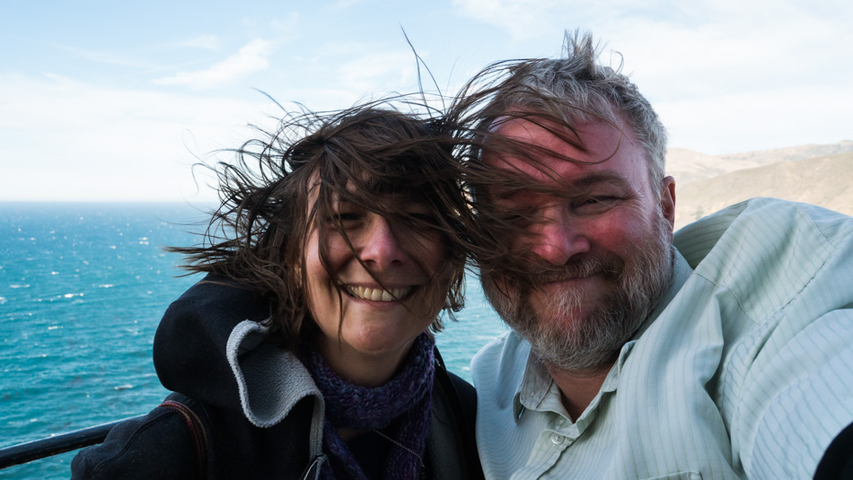 Caroline Wise and John Wise atop the Point Sur Lighthouse on a windy day
