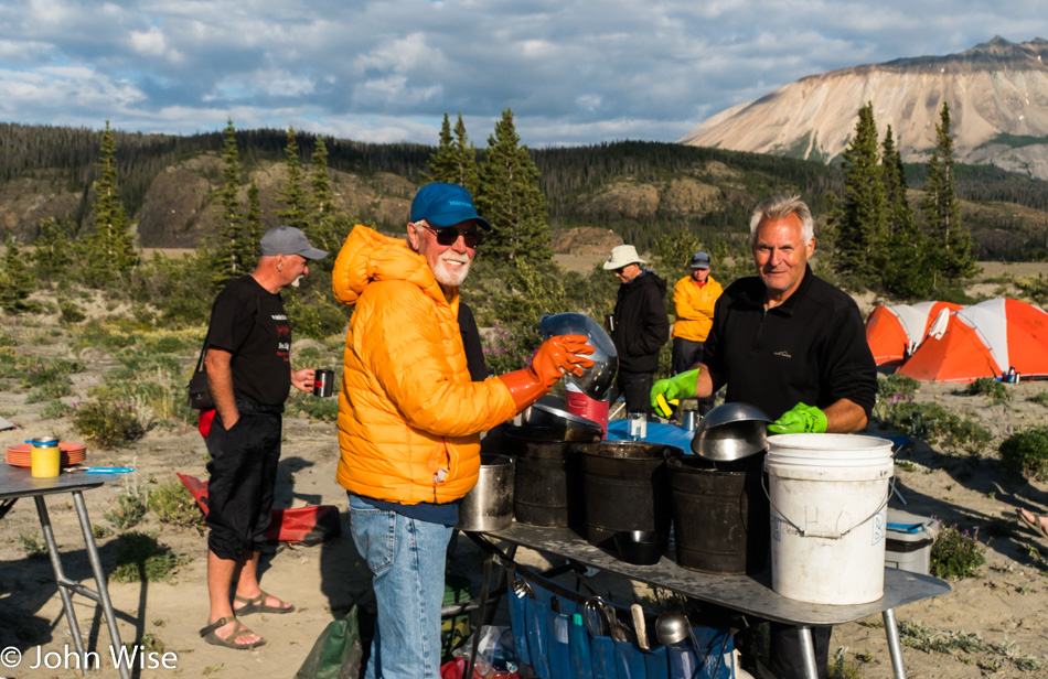 Frank Kozyn and Steve Alt washing dishes on the Alsek River in Yukon, Canada