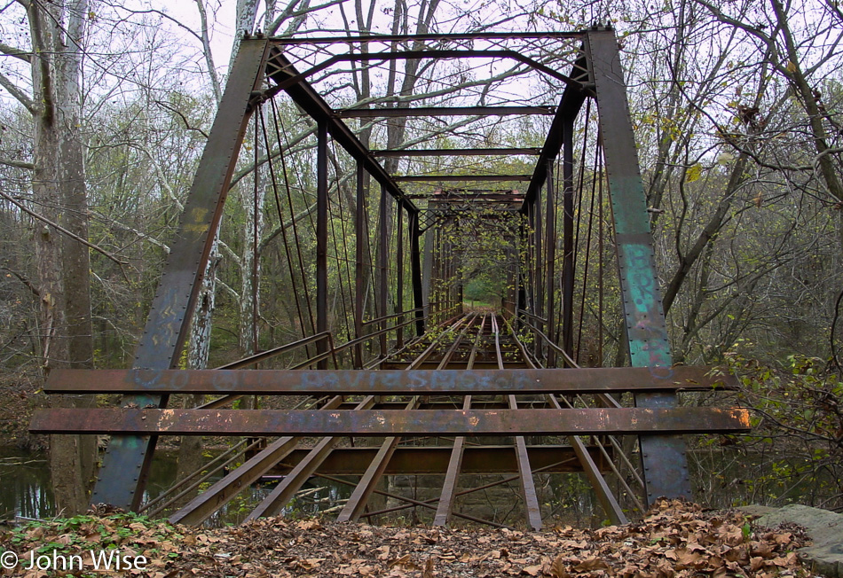 Old decrepit bridge over the Blue river in Indiana