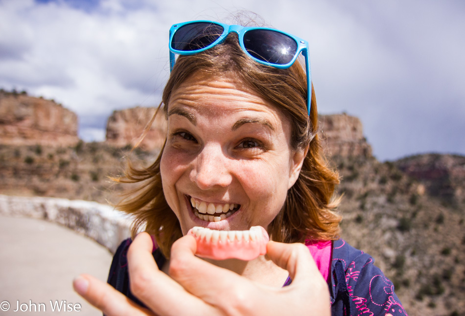 Jessica Aldridge posing with some random false teeth found next to the road in Arizona