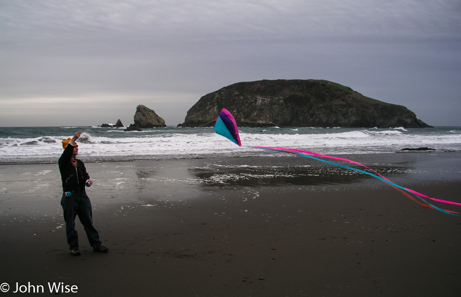 Caroline Wise trying to fly a kite on Harris Beach in Oregon