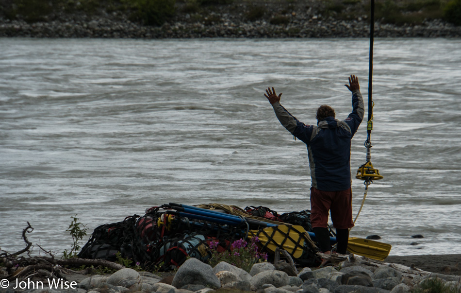 Bruce Keller directing our helicopter pilot to lift our gear at Tweedsmuir Glacier in British Columbia, Canada