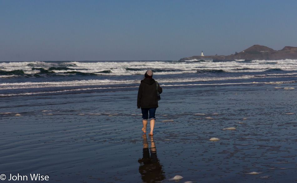 Caroline Wise walking down an Oregon beach