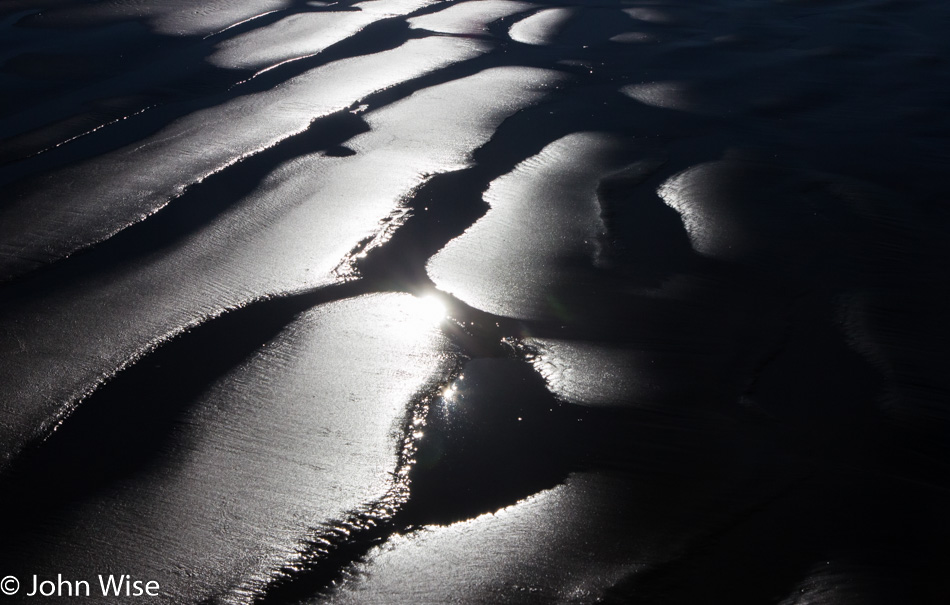 Wet sand on an Oregon beach