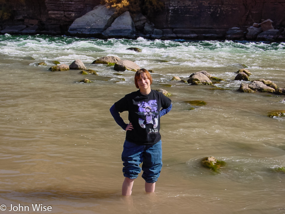 Caroline Wise standing at the confluence of the Colorado and Paria River at Lee's Ferry in the Grand Canyon National Park, Arizona