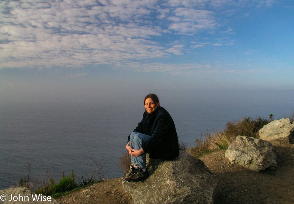 Caroline Wise next to the Pacific Ocean off Highway 1 in California