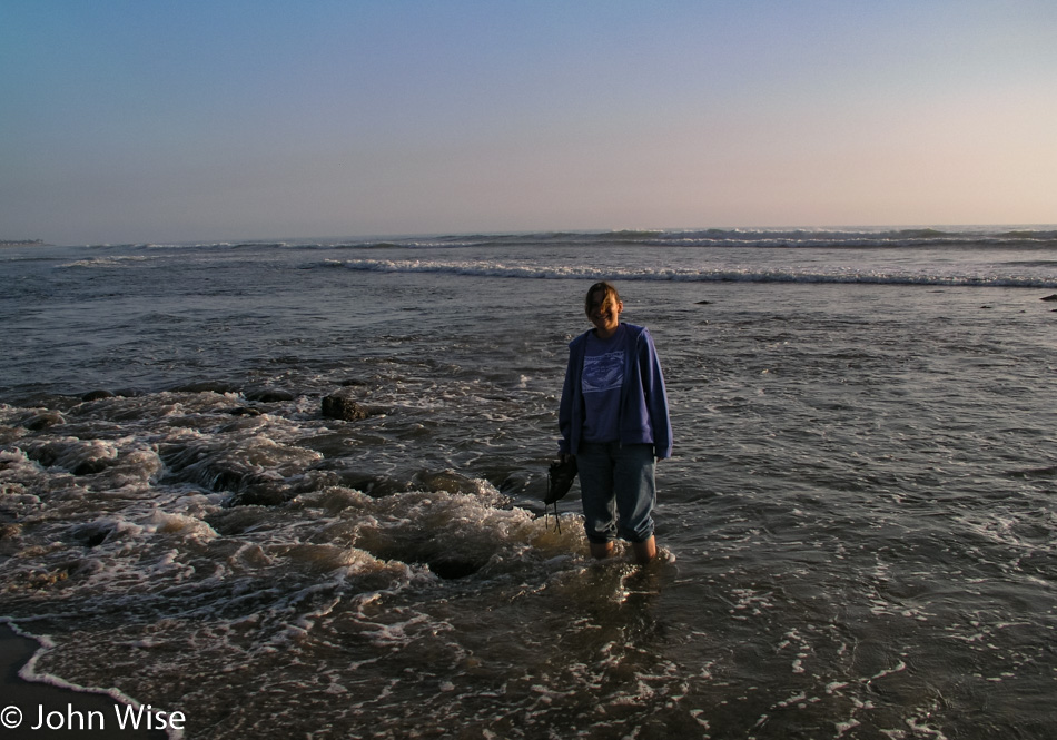 Caroline Wise next to the Pacific Ocean off Highway 1 in California