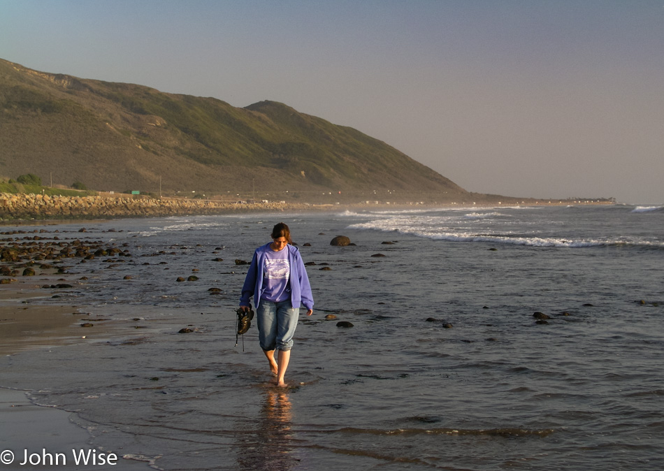 Caroline Wise next to the Pacific Ocean off Highway 1 in California