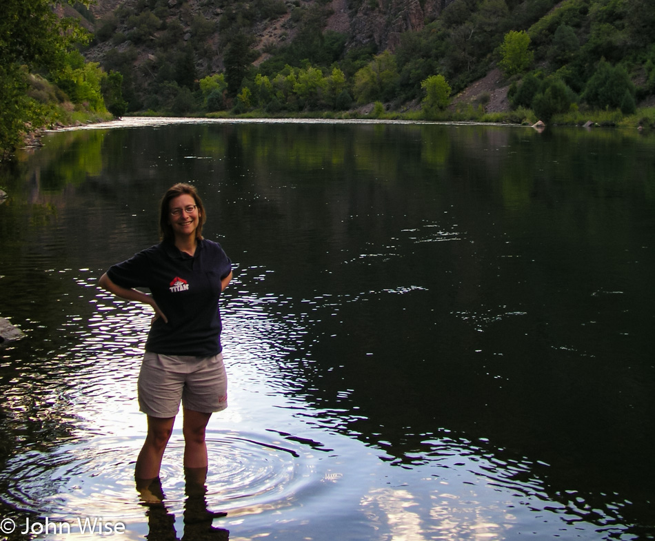 Caroline Wise standing in the Gunnison River in Colorado