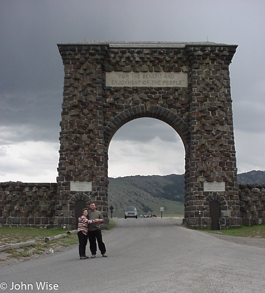 Caroline Wise and John Wise at Roosevelt Arch in Yellowstone National Park year 2000