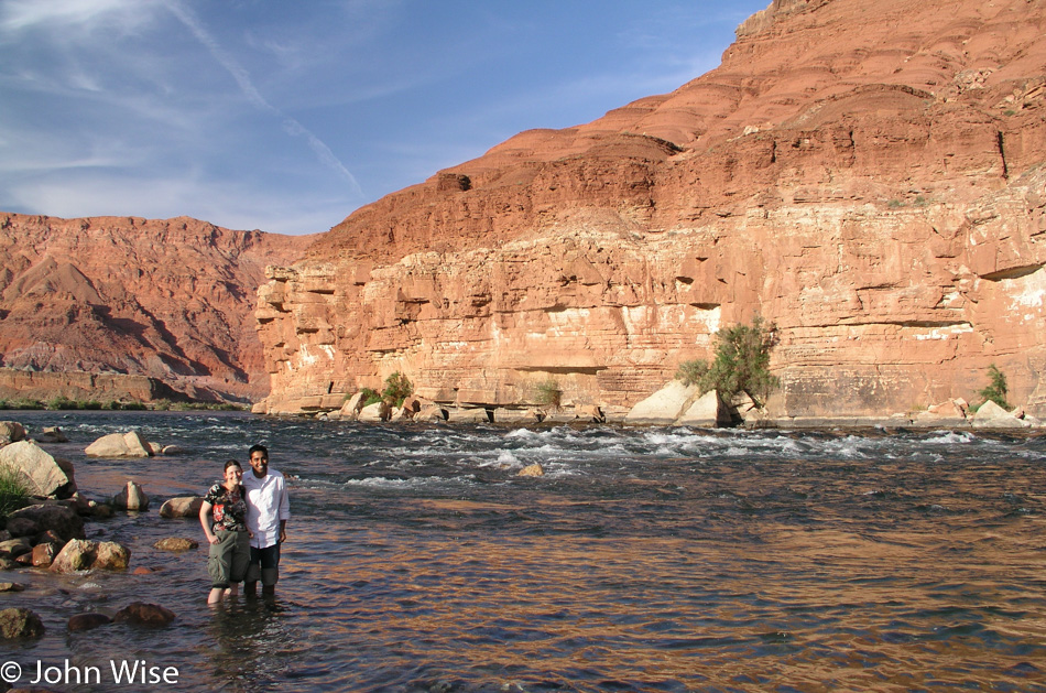 Caroline Wise and Jay Patel standing in the Colorado River at Lees Ferry Grand Canyon Arizona