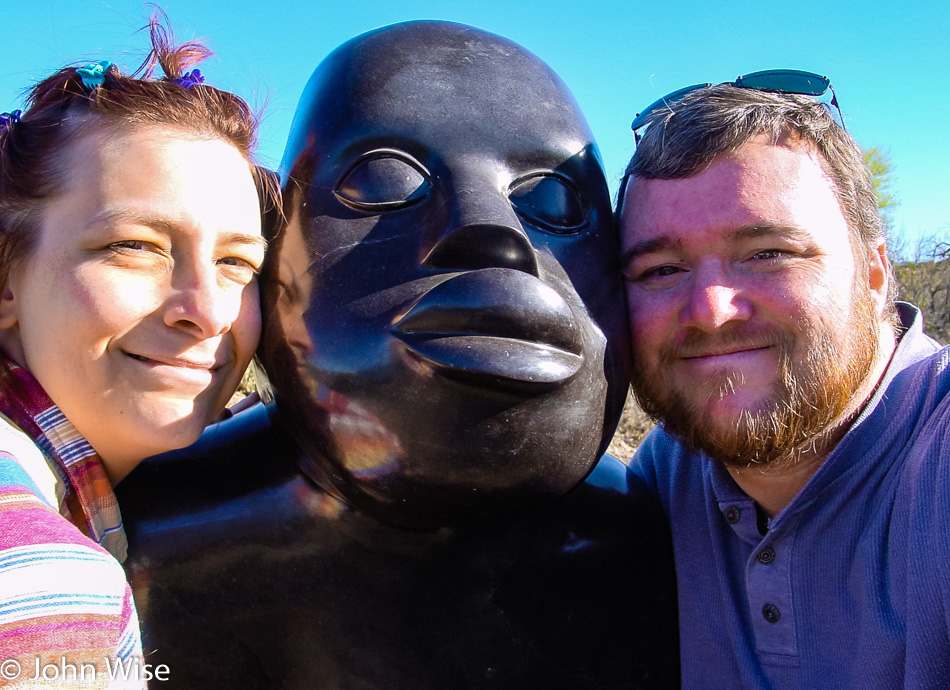 Caroline Wise and John Wise posing with Chapungu sculpture at Boyce Thompson Arboretum near Superior Arizona