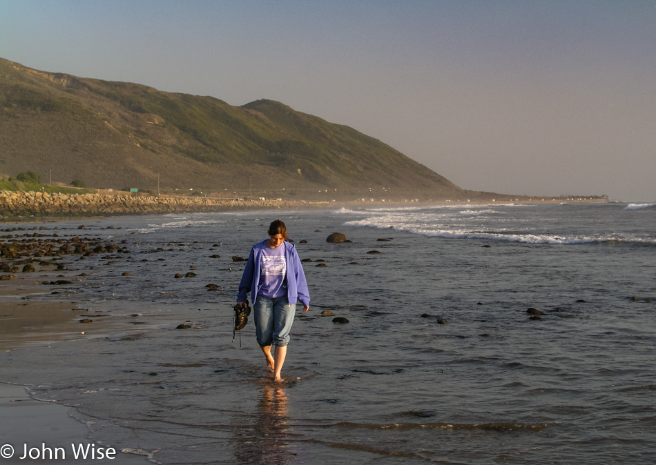 Caroline Wise walking in the surf near Ventura California