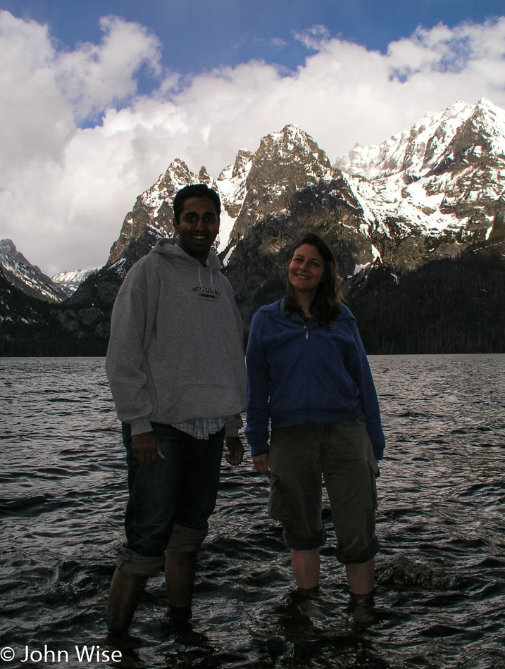 Jay Patel and Caroline Wise standing in Jenny Lake at Grand Teton National Park