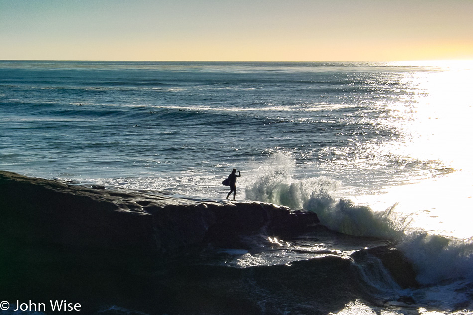 Surfer about to enter the Pacific Ocean in San Diego California