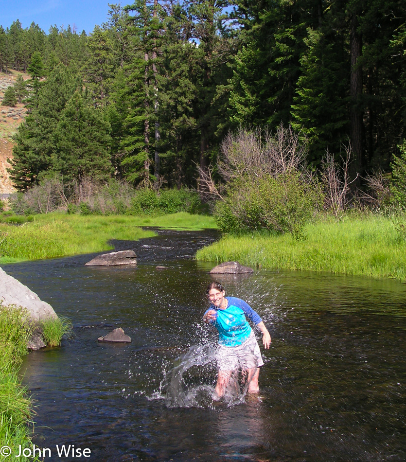 Caroline Wise standing in a small river in Oregon