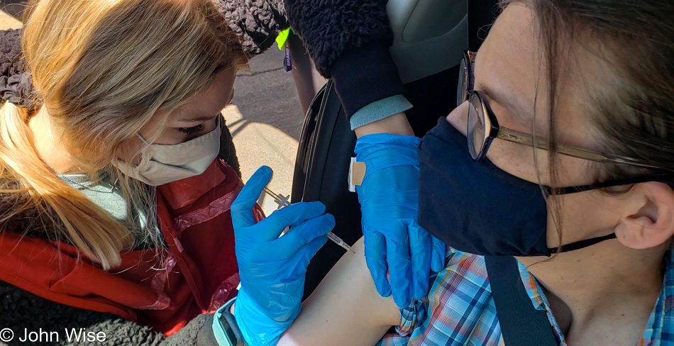 Caroline Wise receiving COVID vaccine