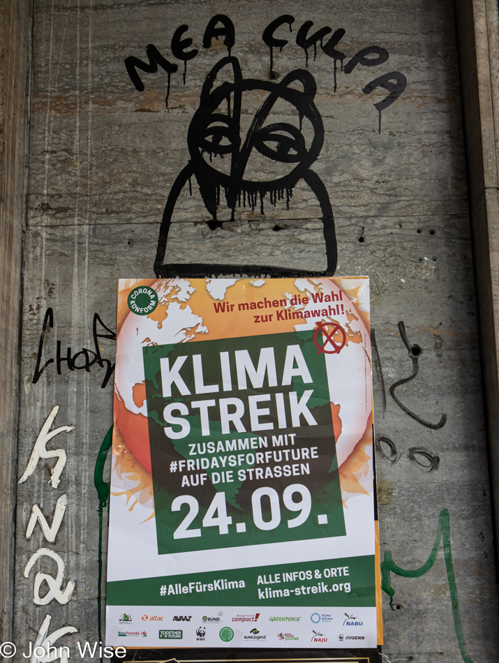 Graffiti and call to action poster in Frankfurt, Germany 