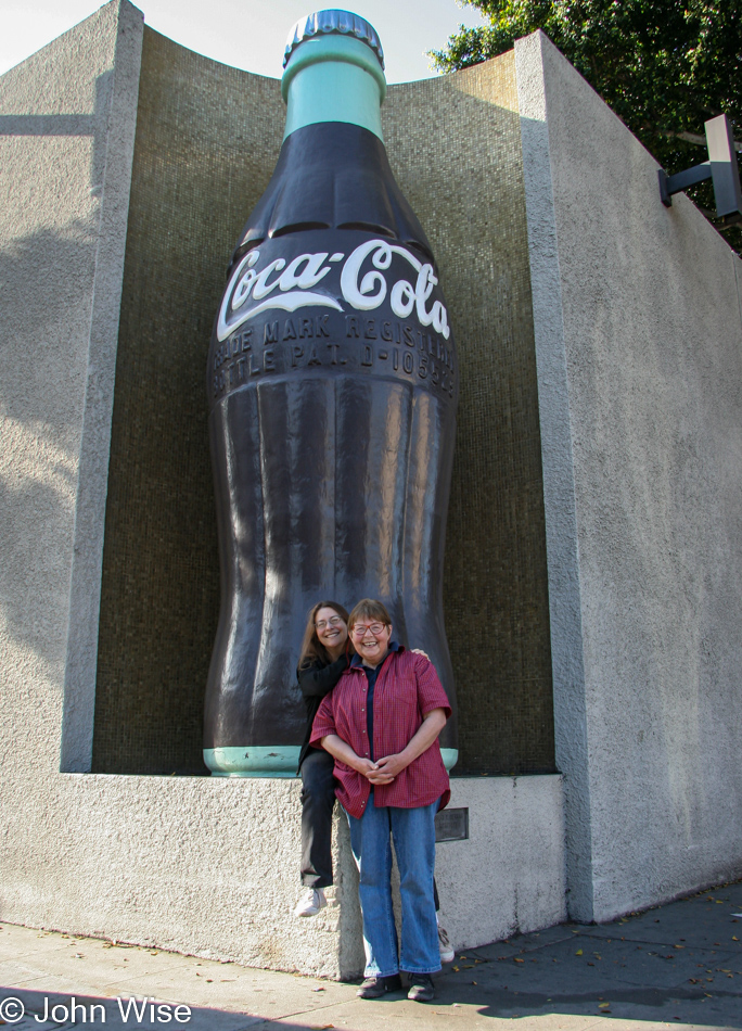 Caroline Wise and Jutta Engelhardt in front of World's Largest Coke Bottle in Los Angeles, California