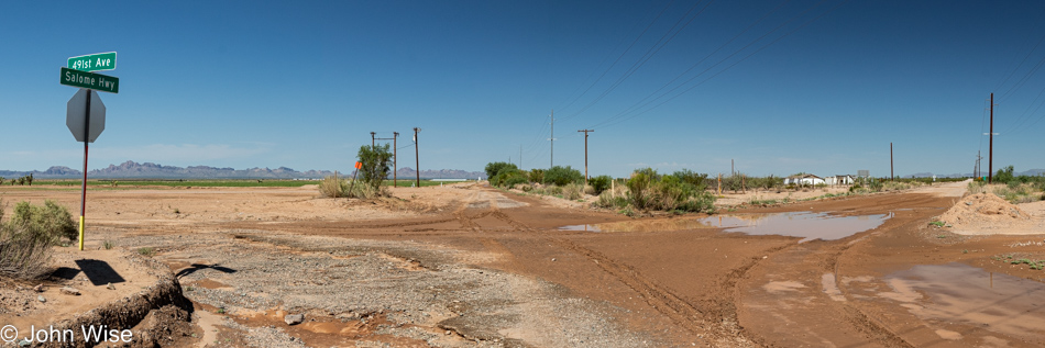 Muddy intersection of Salome Highway and 491st Avenue west of Phoenix, Arizona