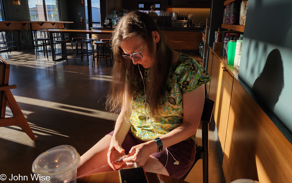 Caroline Wise spinning fiber to make yarn in Phoenix, Arizona