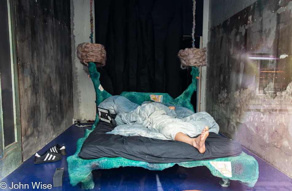 Man sleeping in shop window Copenhagen, Denmark