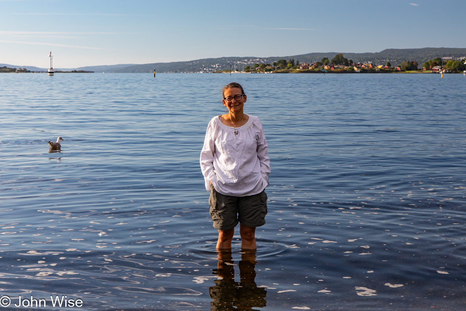 Caroline Wise standing in Oslofjord on Bygdøy Peninsula in Oslo, Norway