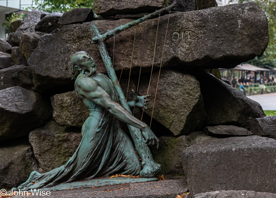 Fossegrim at the foot of the Ole Bull statue in Bergen, Norway